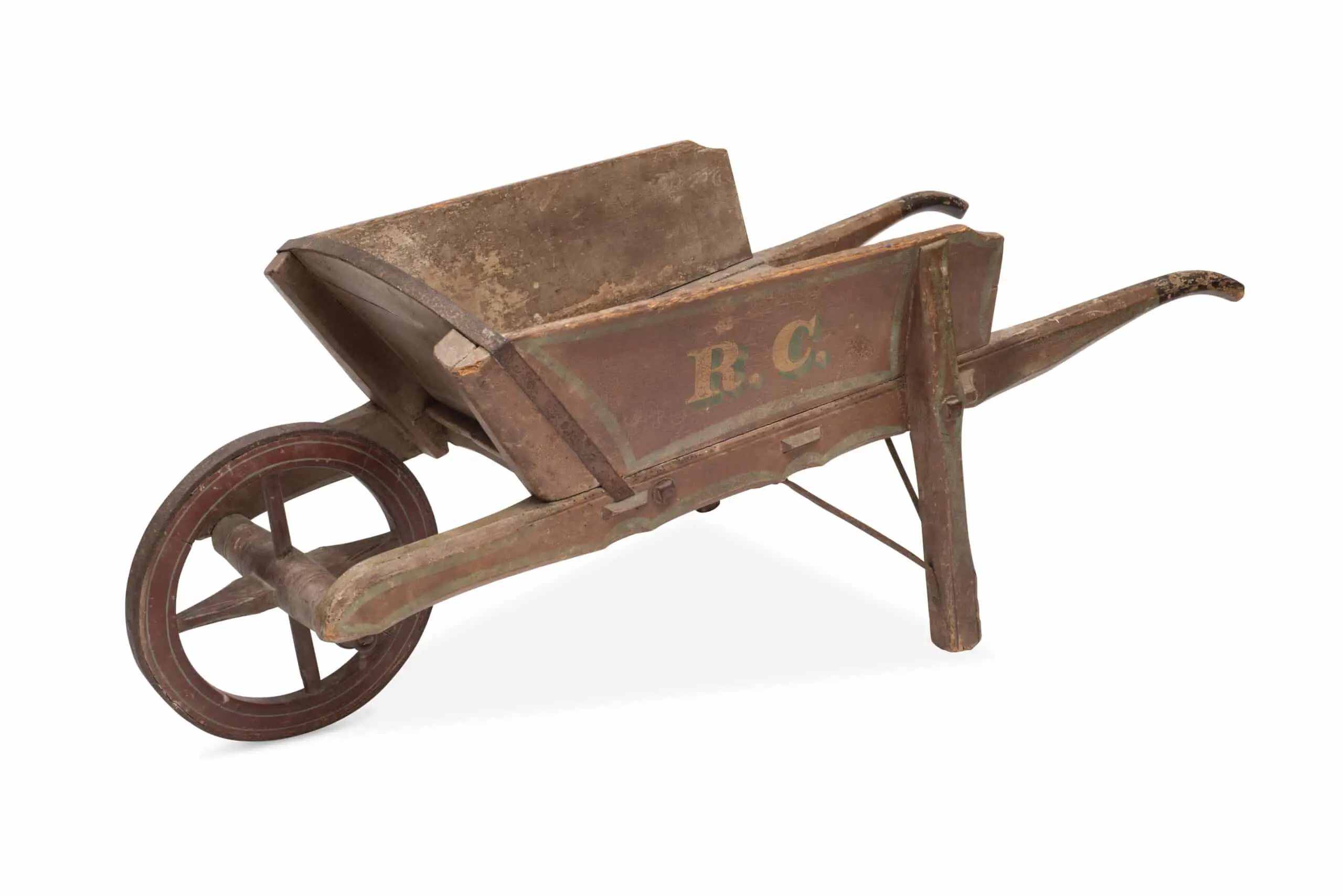 Cut-out of an antique wooden wheelbarrow.