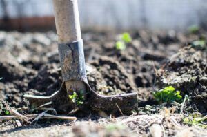 Shovel digging mud.