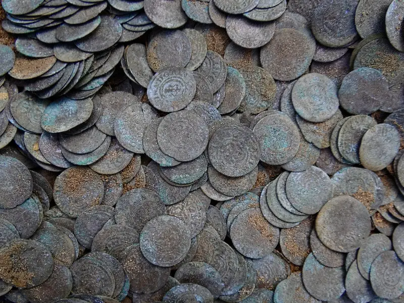 A pile of old copper coins