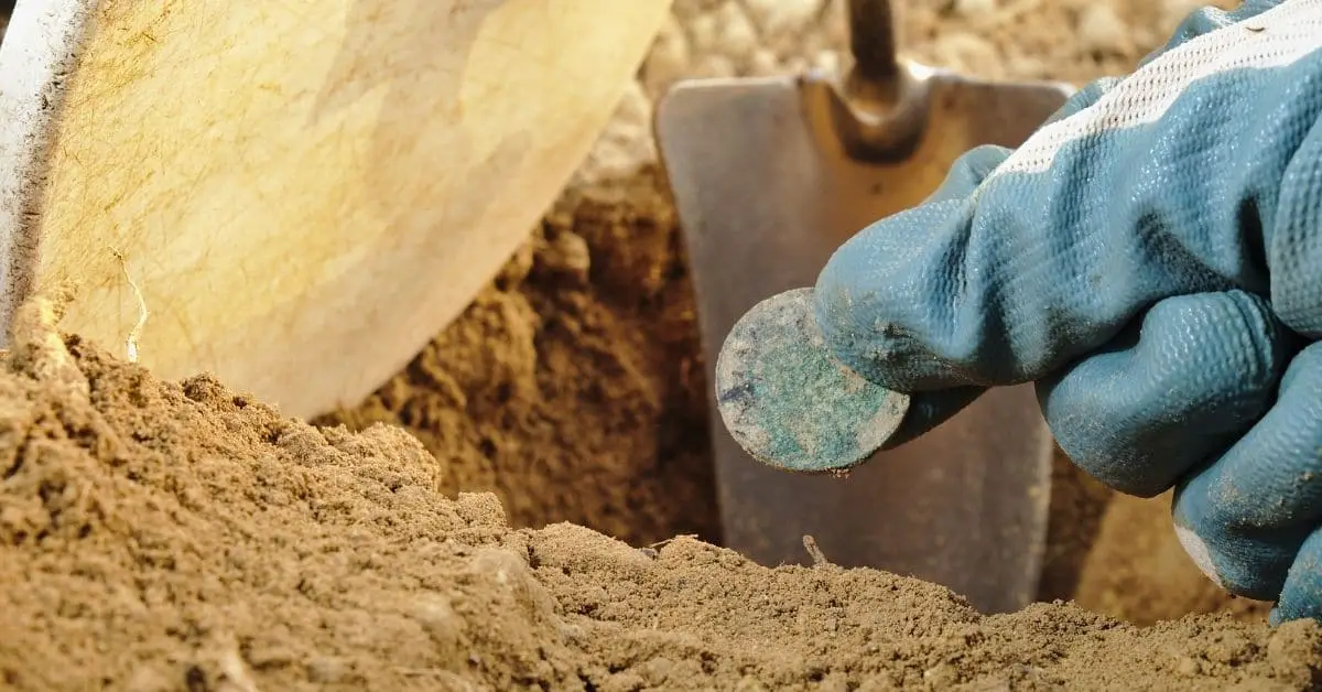 Finding a coin in the ground.