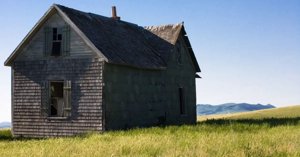 Old homestead in middle of a field.