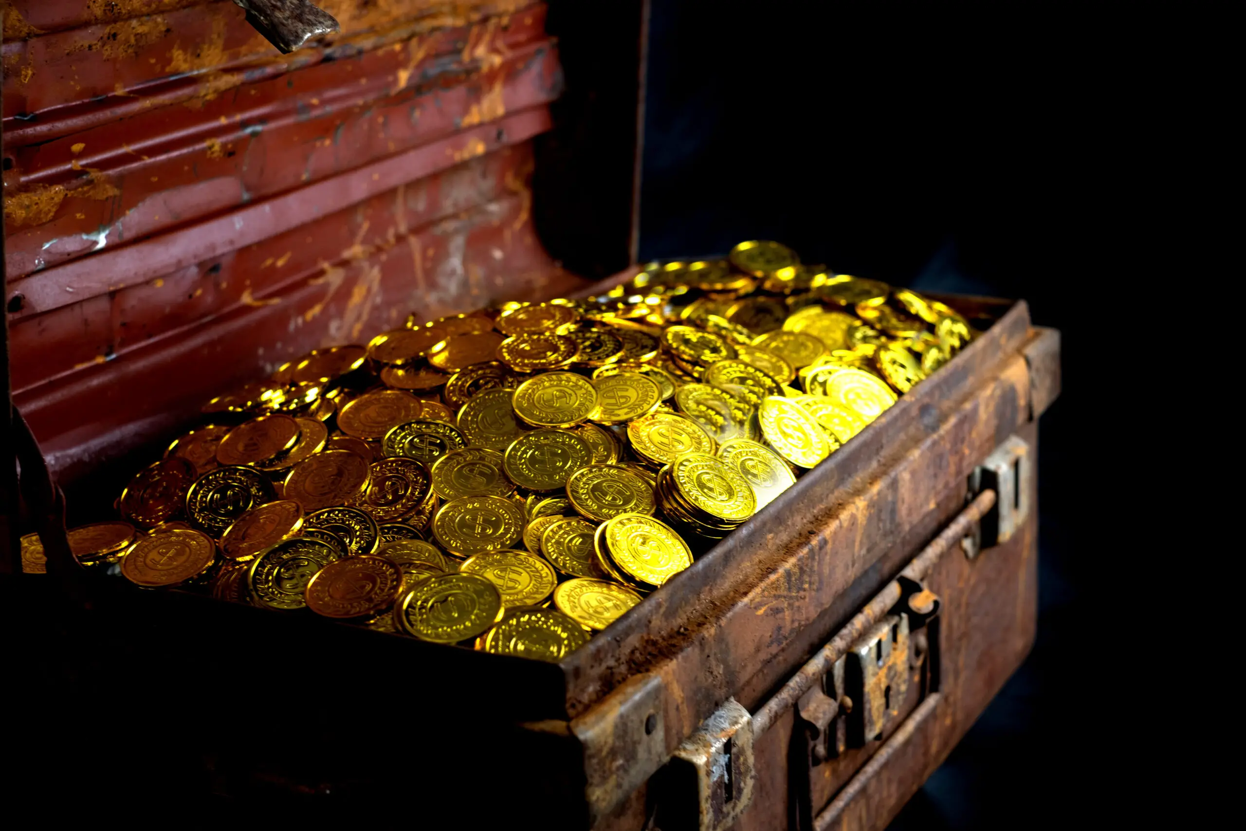 Gold Coins in treasure chest on black background