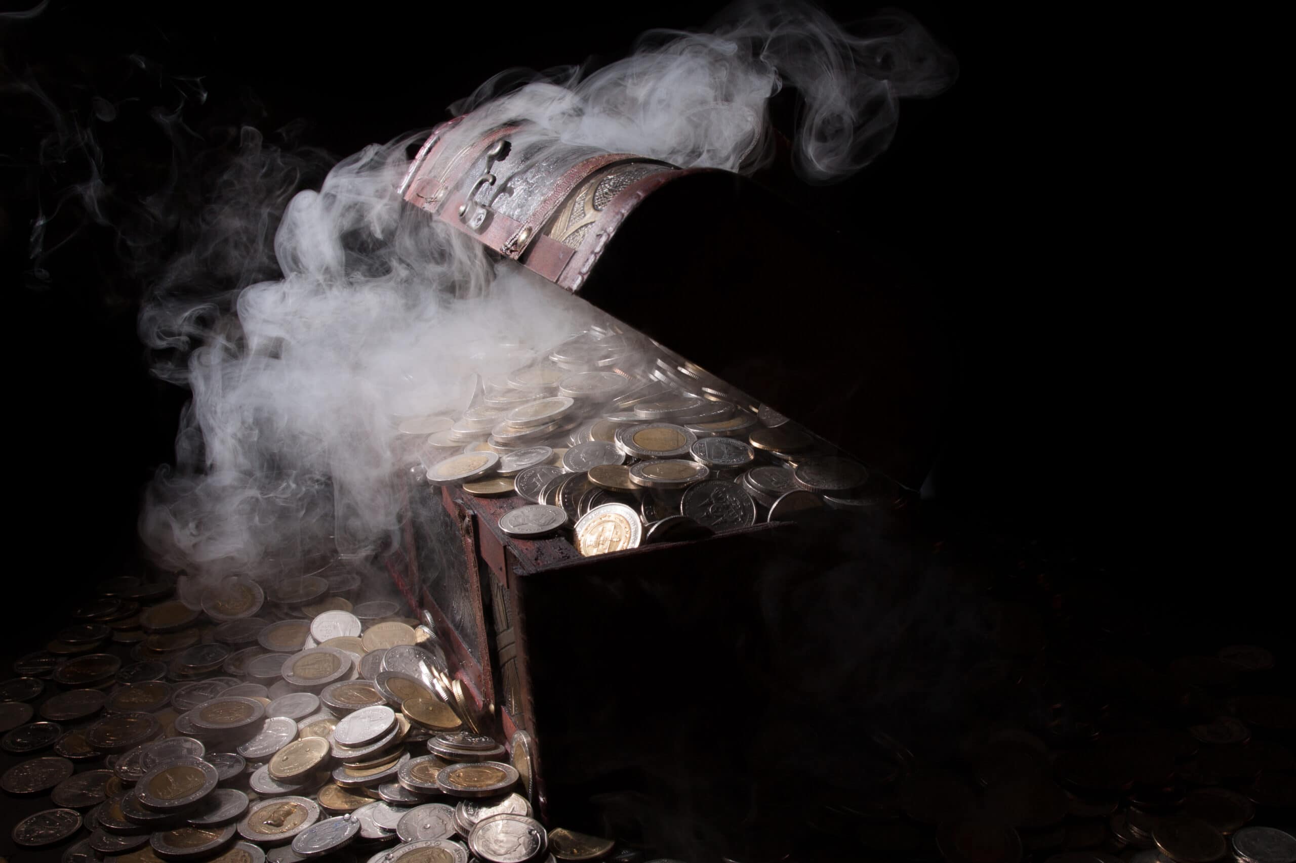 Treasure chest filled with coin baht and fog. 